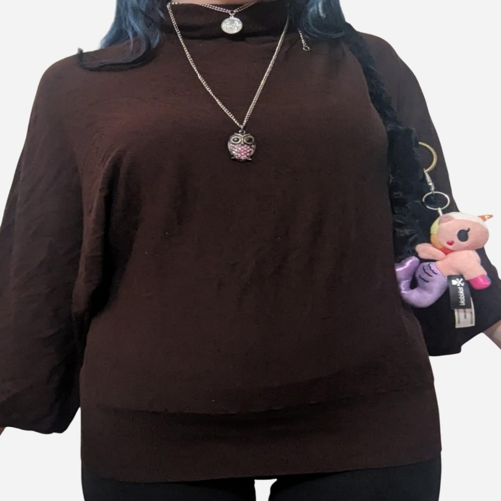 Unique silk parachute style brown turtleneck blouse by Susan Lewis.